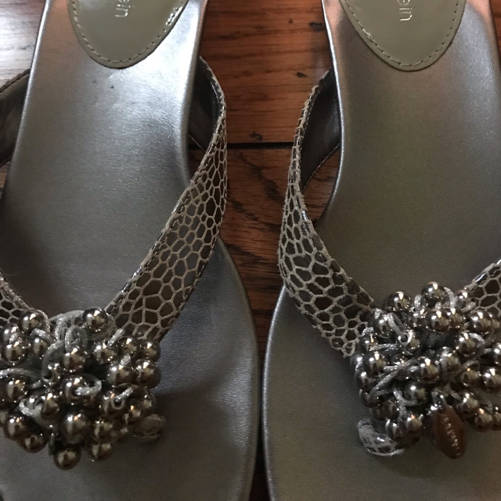Calvin Klein leather flip flops.
